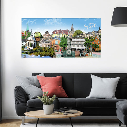 Bernd Röttgers Essen-Steele Stadtbild als Acrylbild mit Alu-Rückrahmen über einem schwarzen Sofa mit einem roten und zwei grauen Kissen und einem runden Couchtisch aus Holz davor.