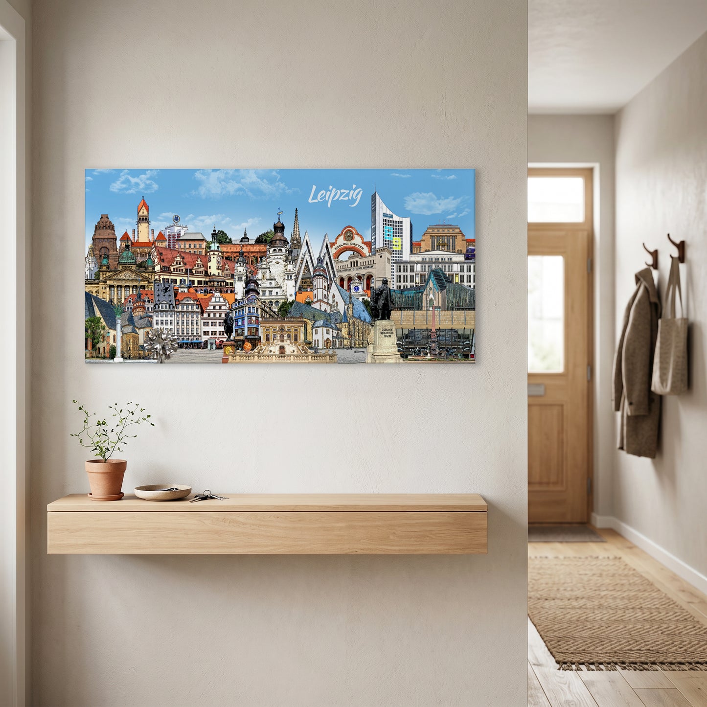 Leipzig Leinwand als stilvolles Wandbild im Querformat über einem hellen Holz-Sideboard im modernen Flur aufgehängt.