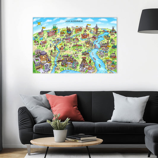 Jacques Tilly Niederrhein Wimmelbild auf Leinwand mit Holzrahmen über einem schwarzen Sofa mit einem roten und zwei grauen Kissen und einem runden Couchtisch aus Holz davor.